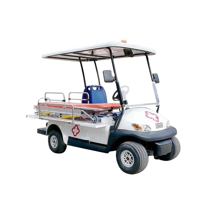 ocean cartz studio shot of a white electric ambulance golf cart or medical utility vehicle with a white roof, set against a white background. This emergency response cart is equipped with a stretcher or patient transport bed in the rear, surrounded by chrome safety rails. A red cross medical logo is visible on the side and front hood, highlighting its specialized rescue golf cart function.