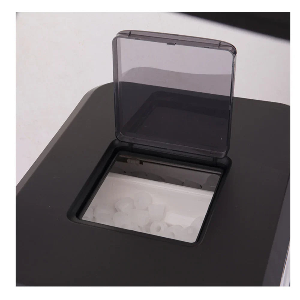 Black ice maker with clear cover on a white background