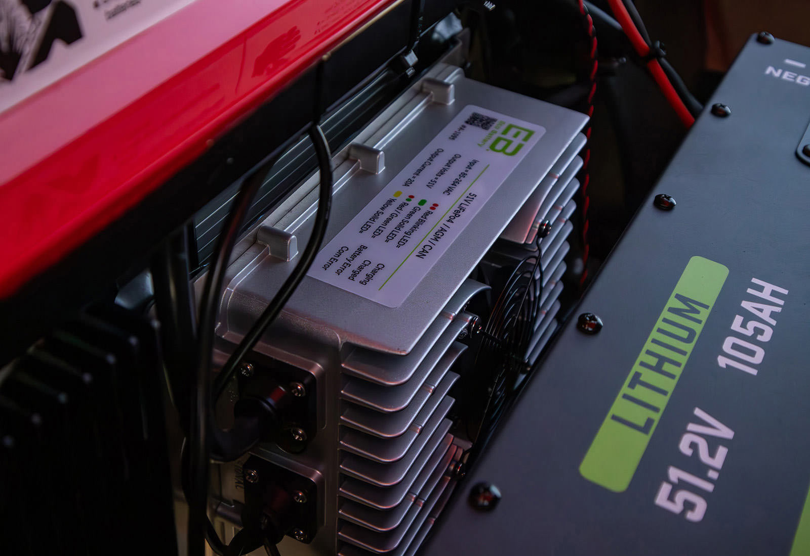 Close-up of a lithium battery with specifications on a dark background
